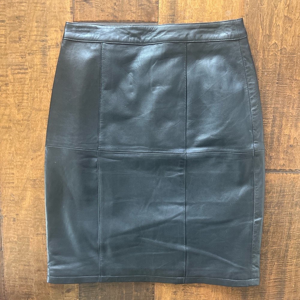 Black leather midi knee length skirt with zipper and button closure